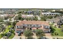 Aerial view of residential area with tile roof townhomes at 14088 Tarvin St, Orlando, FL 32832