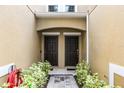 Charming townhouse entrance with inviting walkway and dual front doors at 14242 Desert Haven St # Ge, Windermere, FL 34786