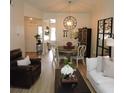 Open living and dining area with wood floors and lots of natural light at 2480 Tahoe Cir # 2480, Winter Park, FL 32792