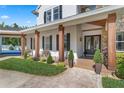 Inviting front porch with wooden columns and manicured garden at 5801 Marleon Drive Marleon Drive, Windermere, FL 34786