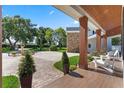 Charming covered porch area with brick accents and outdoor seating at 5801 Marleon Drive Marleon Drive, Windermere, FL 34786