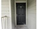 Unit 202, featuring a black door and an ornate door knocker at 5980 Westgate Dr Dr # 202, Orlando, FL 32835