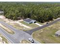 Aerial view of a newly constructed home on a large lot surrounded by lush greenery at 6516 Sw 149 Th Lane Rd, Ocala, FL 34473