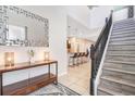Open foyer showcasing staircase and views into the kitchen and main living areas at 8901 Rhodes St, Kissimmee, FL 34747