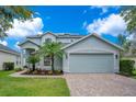 Beautiful two-story house with a well-manicured lawn and a two-car garage at 912 Pickfair Ter, Lake Mary, FL 32746
