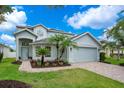 Charming two-story home with landscaped yard and a two-car garage at 912 Pickfair Ter, Lake Mary, FL 32746