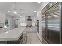 Modern kitchen with stainless steel appliances, a large island, and pendant lighting at 105 Laurel Oak Dr, Longwood, FL 32779