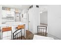 Charming kitchen features a breakfast bar and a view into the dining area at 200 St Andrews Blvd # 601, Winter Park, FL 32792
