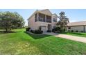 Charming two-story home with manicured lawn at 20130 Sunset Landing Ave, Groveland, FL 34736