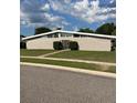 Inviting single-story home with horizontal windows and a neatly landscaped front yard at 229 Doverwood Rd, Fern Park, FL 32730