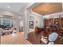 Elegant home featuring decorative columns, hardwood floors, and sophisticated decor at 25554 Hawks Run Ln, Sorrento, FL 32776