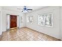 Entrance showing tile floors, ceiling fan and front door at 311 Cortland Ave, Winter Park, FL 32789