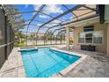 Inviting screened-in pool with a clear blue water and patio at 3816 Eagle Isle Cir, Kissimmee, FL 34746