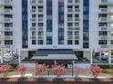 Beautiful entrance to the 400 Park Lake Towers building with flowers and awning at 400 E Colonial Dr # 1501, Orlando, FL 32803