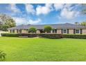 Well-maintained lawn and mature landscaping enhance this lovely home's curb appeal at 400 Timbercove Pl, Longwood, FL 32779