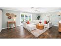 Bright living room featuring a decorative fireplace, and sliding glass doors to the outdoor space at 417 Monticello Dr, Altamonte Springs, FL 32701