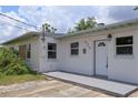 Charming single-story home displaying a freshly painted exterior and a welcoming front porch at 438 Romano Ave, Orlando, FL 32807