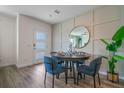 Cozy dining area featuring modern decor, stylish round table, and elegant wall accents at 5641 Brosnan Rd, St Cloud, FL 34771