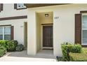 The front entry features a covered entrance and well-maintained landscaping at 600 Northern Way # 607, Winter Springs, FL 32708