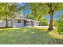 Charming single-story home with a well-maintained lawn and mature trees at 706 19Th St, Orlando, FL 32805
