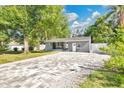Inviting single-story home with a charming front porch and well-manicured landscaping at 706 19Th St, Orlando, FL 32805
