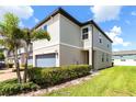 Attractive townhouse features manicured bushes, a two car garage and a well-maintained lawn offering comfort and style at 1024 Desert Candle Dr, Ocoee, FL 34761