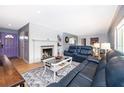 Cozy living room features a fireplace, hardwood floors, and comfortable seating at 1301 Fahnstock St, Eustis, FL 32726