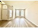Bright living room with large windows, new flooring, and plenty of natural light at 14700 Chadbury Ct, Orlando, FL 32828