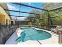 Enjoy Florida's sunshine in this private screened-in pool with a fenced yard at 165 Scrub Jay Way, Davenport, FL 33896