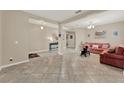 Spacious living room features tile flooring, columns and neutral paint, creating a bright and inviting space at 1692 Blue Grass Blvd, Deland, FL 32724