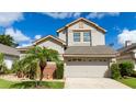 Lovely two-story home with a two-car garage and mature landscaping, providing a welcoming atmosphere at 2638 Clarinet Dr, Orlando, FL 32837