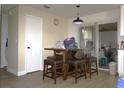 Cozy dining area with a table and chairs set with slider door access to outdoor at 1211 Phillip St, Winter Springs, FL 32708