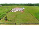 Wide aerial shot of property showcasing the home and expansive lawn at 13023 Sweet Hill Rd, Polk City, FL 33868