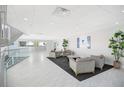 Inviting lobby area with modern furnishings, plants, and a reception desk at 151 E Washington St # 424, Orlando, FL 32801