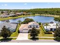 Beautiful home with a lake view, mature trees, and well-maintained lawns in a quiet neighborhood at 2512 Chapala Dr, Kissimmee, FL 34746