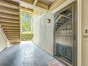 Welcoming condo entryway featuring decorative door, secure mailboxes, and convenient stair access at 305 West Lake Faith Dr # 139, Maitland, FL 32751