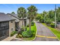 Beautifully landscaped condo community with palm trees, well-maintained grounds, and convenient street access at 305 West Lake Faith Dr # 139, Maitland, FL 32751