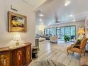 Bright and airy living room with stylish decor, natural light, and sliding glass doors to outdoor views at 305 West Lake Faith Dr # 139, Maitland, FL 32751