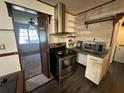 View of a modern stainless steel oven and stovetop with plenty of counter space at 3540 Garland St, Mulberry, FL 33860