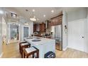 Open-concept kitchen with granite island, stainless appliances, and ample cabinet space, ideal for entertaining at 447 Kehoe Blvd, Orlando, FL 32825