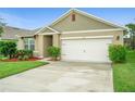Close up of the front exterior highlighting the manicured landscaping at 522 Anne St, Deland, FL 32724