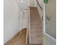 Inviting entryway featuring a staircase, modern door, and neutral wall colors at 8484 Sperry St, Orlando, FL 32827