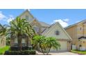 Inviting home with well-maintained landscaping, a two-car garage, and vibrant green grass, offering a warm and welcoming atmosphere at 1509 Cedar Lake Dr, Orlando, FL 32824