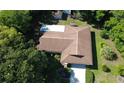 Aerial shot reveals a well-maintained roof, private backyard, and mature landscaping at 1509 Huntington St, Deltona, FL 32725
