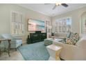 Cozy living room with bright windows, plantation shutters, and comfortable furniture at 1636 Hanks Ave, Orlando, FL 32814