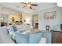 Comfortable living room offering open floor plan, plush sofa, and easy access to kitchen and dining areas at 1636 Hanks Ave, Orlando, FL 32814