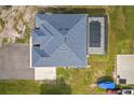 Aerial view of a home featuring a screened-in pool, large backyard and ample parking at 18826 Reynolds Pkwy, Orlando, FL 32833