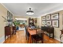 Classic dining room featuring hardwood floors, tan walls, and decorative vintage accents at 1924 Summerfield Rd, Winter Park, FL 32792