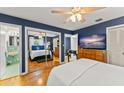 This main bedroom has an en suite bath, and a mirrored closet with room for a work out area at 1924 Summerfield Rd, Winter Park, FL 32792