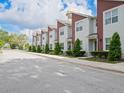 Exterior street view featuring the townhome community and Longwood water tower at 193 E Warren Ave, Longwood, FL 32750